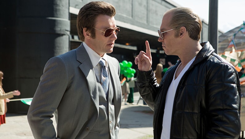JOEL EDGERTON as FBI Agent John Connolly and JOHNNY DEPP as Whitey Bulger in the drama "BLACK MASS."