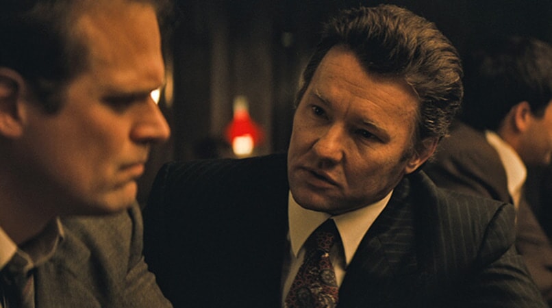 DAVID HARBOUR as John Morris and JOEL EDGERTON as John Connolly in the drama "BLACK MASS."