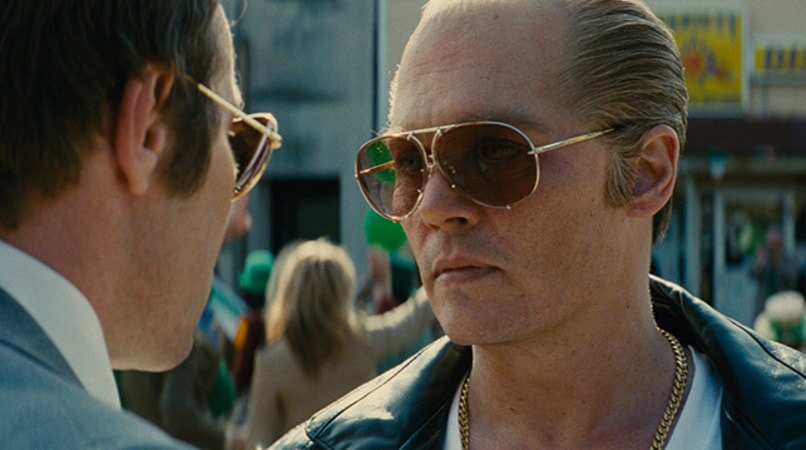 JOEL EDGERTON as FBI Agent John Connolly and JOHNNY DEPP as Whitey Bulger in the drama "BLACK MASS."