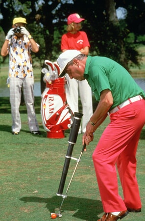 rodney dangerfield as al czervik uses his laser-guided putter in caddyshack