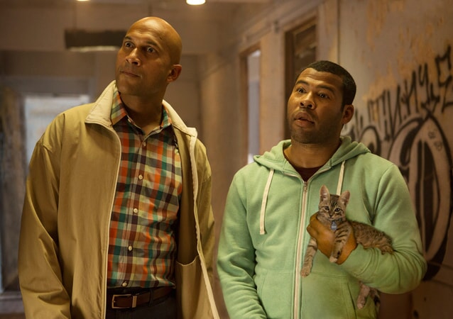 KEEGAN-MICHAEL KEY as Clarence Goobril and JORDAN PEELE as Rell Williams holding Keanu the kitten