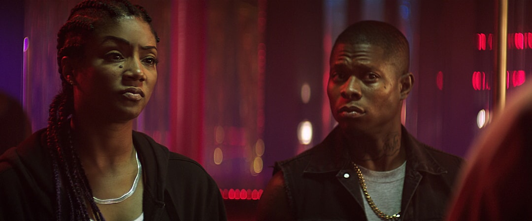 TIFFANY HADDISH as Hi-C and JASON MITCHELL as Bud