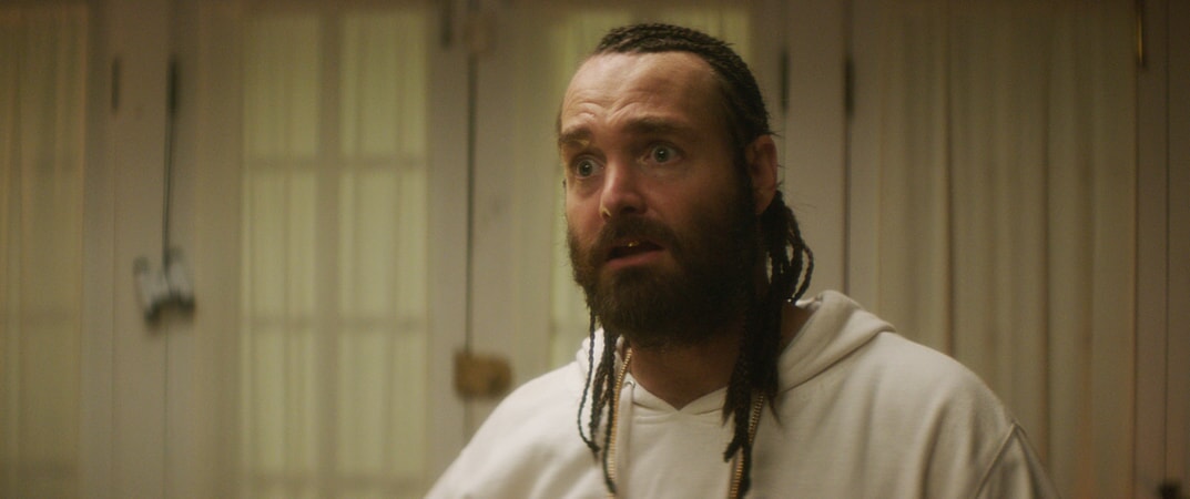 WILL FORTE as Hulka with braided hair and beard