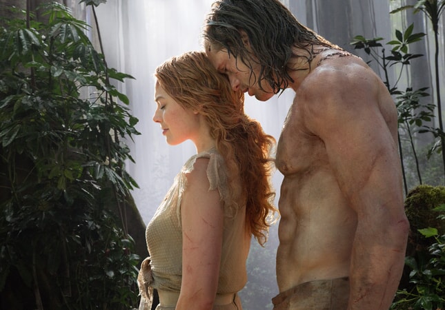 Margot Robbie as Jane Porter and Alexander Skarsgård as Tarzan standing next to each other