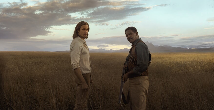 ALEXANDER SKARSGÅRD as Tarzan and SAMUEL L. JACKSON as George Washington Williams 