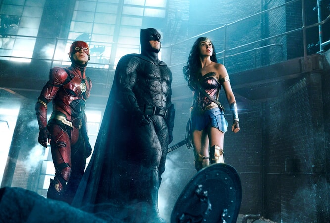 EZRA MILLER as The Flash, BEN AFFLECK as Batman and GAL GADOT as Wonder Woman in Warner Bros. Pictures' action adventure "JUSTICE LEAGUE," a Warner Bros. Pictures release.