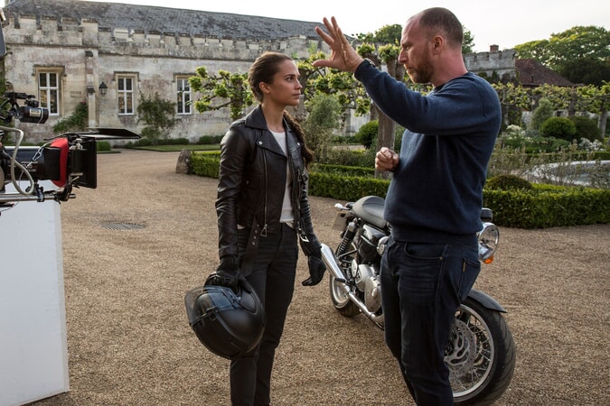 (L-R) ALICIA VIKANDER and director ROAR UTHAUG on the set of Warner Bros. Pictures' and Metro-Goldwyn-Mayer Pictures' action adventure "TOMB RAIDER," a Warner Bros. Pictures release.