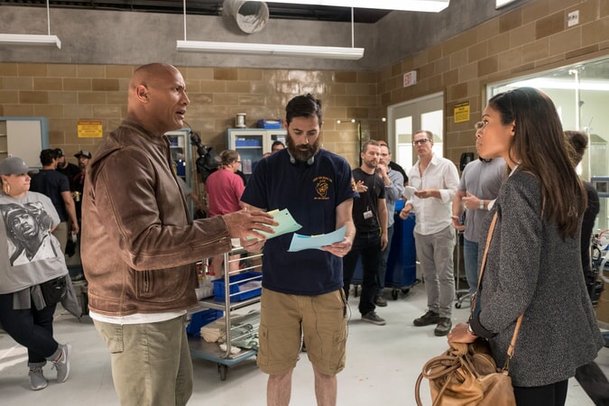 (Front L-R) DWAYNE JOHNSON, director/producer BRAD PEYTON and NAOMIE HARRIS on the set of New Line Cinema's and ASAP Entertainment's action adventure "RAMPAGE," a Warner Bros. Pictures release.