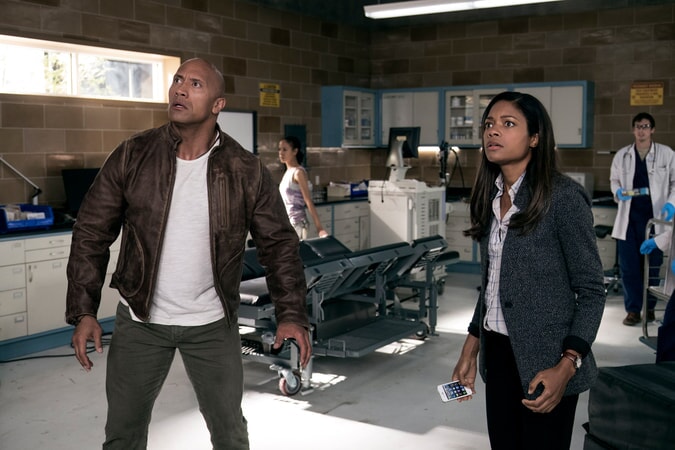 DWAYNE JOHNSON as Davis Okoye and NAOMIE HARRIS as Dr. Kate Caldwell in New Line Cinema's and ASAP Entertainment's action adventure "RAMPAGE," a Warner Bros. Pictures release.