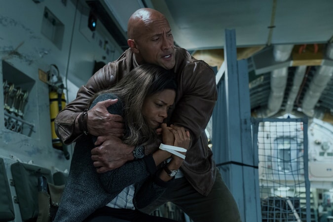 NAOMIE HARRIS as Dr. Kate Caldwell and DWAYNE JOHNSON as Davis Okoye in New Line Cinema's and ASAP Entertainment's action adventure "RAMPAGE," a Warner Bros. Pictures release.