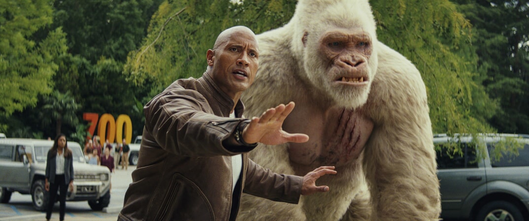 (L-R) DWAYNE JOHNSON as Davis Okoye and JASON LILES as George in New Line Cinema's and ASAP Entertainment's action adventure "RAMPAGE," a Warner Bros. Pictures release.