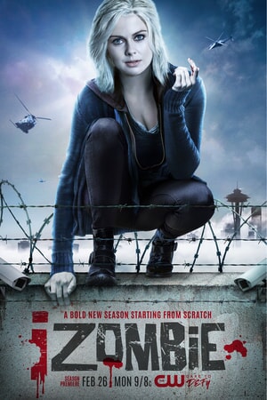 Rose McIver as Liv crouching on a barbed wired stone wall while helicopters hove above