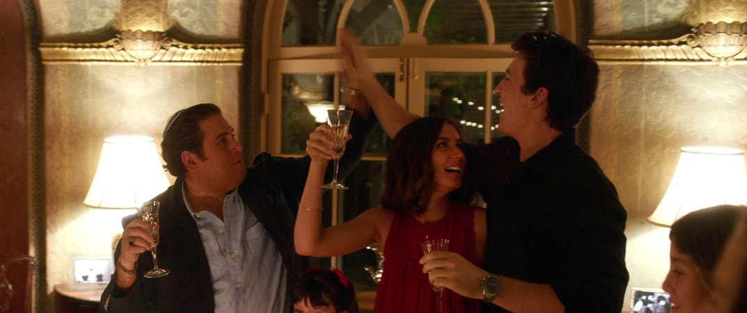 JONAH HILL as Efraim, ANA DE ARMAS as Iz and MILES TELLER as David in Warner Bros. Pictures' comedic drama (based on true events) "WAR DOGS," a Warner Bros. Pictures release.