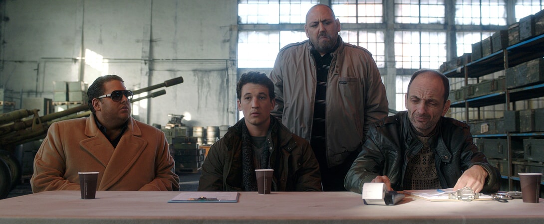 JONAH HILL as Efraim, MILES TELLER as David, JB BLANC as Bashkim and GABRIEL SPAHIU as Enver in Warner Bros. Pictures' comedic drama (based on true events) "WAR DOGS," a Warner Bros. Pictures release.